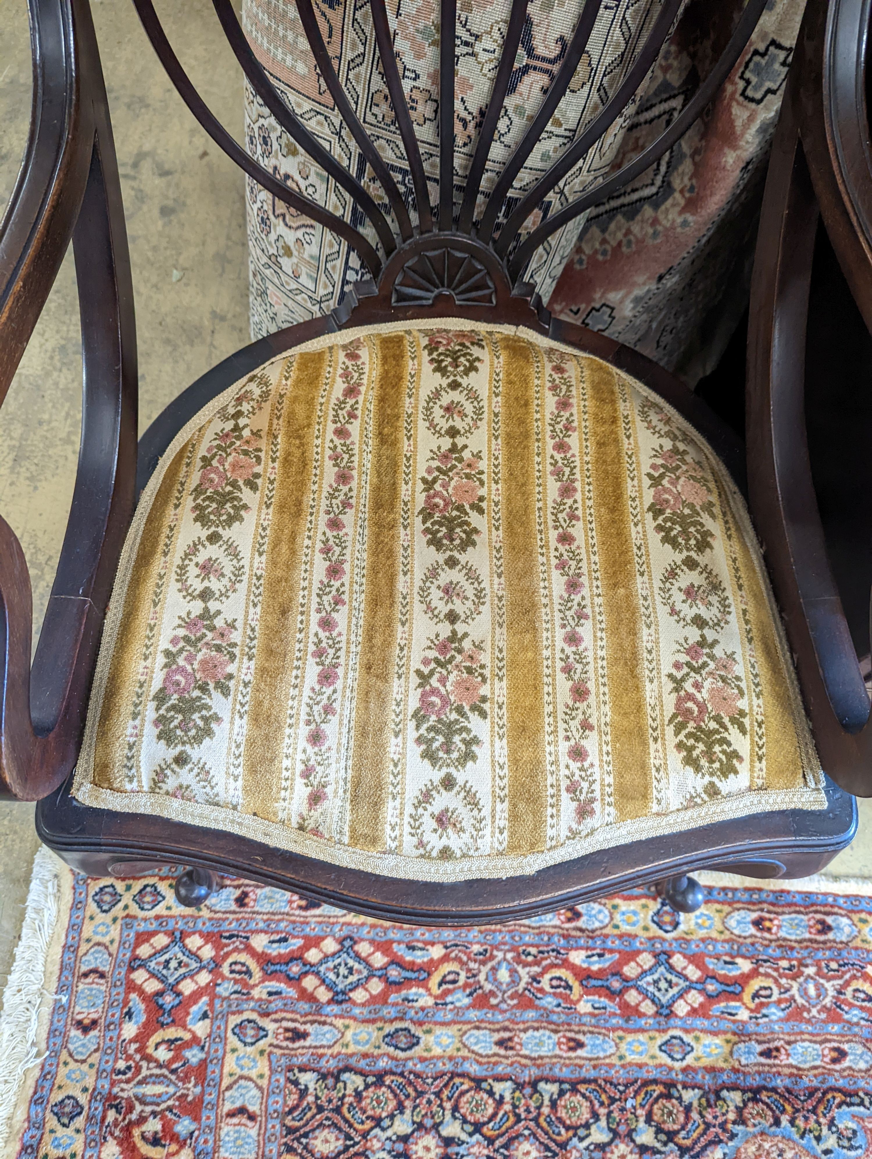 A late Victorian carved mahogany elbow chair